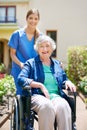 I love bringing smiles to my patients faces. a resident and a nurse outside in the retirement home garden. Royalty Free Stock Photo