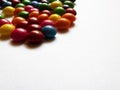 Colorful candies on white background with copy space