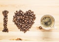 I love coffee, beans and a cup on the wooden table Royalty Free Stock Photo