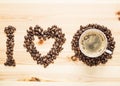 I love coffee, beans and a cup on the wooden table Royalty Free Stock Photo
