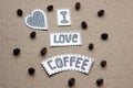 I love coffee lettering with grains of coffee on a cardboard ba