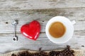 I love coffee quote with natural coffee beans in heart shape on a wooden kitchen table