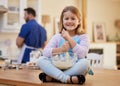 I love when dad lets me bake. a little girl stirring a bowl of batter. Royalty Free Stock Photo