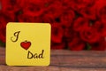 I Love Dad text with Red roses in a bunch as a background. Royalty Free Stock Photo