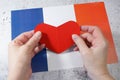 I love France. Red heart symbol in hands on Franch flag background. Bastille Day, 14 July Royalty Free Stock Photo