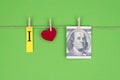 I love Franklin concept. Close up view photo of american usd money and small red heart attached on rope isolated over bright green Royalty Free Stock Photo