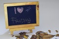 I love friday written on a chalkboard. Autumn seasonal flat lay photo on White background