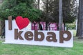 `I love Kebab` sign in Turkish language at garden in Adana Gastronomic Festival in Turkey country, outdoor photography