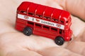 I love London message on red bus, souvenir and symbol of London City, isolated on womanÃ¢â¬â¢s hand Royalty Free Stock Photo