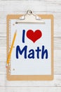 I love Math message on graph paper with a clipboard and pencil