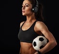 I love my body, fit, mobile, strong, flexible (look description under photo). Sport woman holding ball in headphones