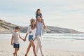 I love my little family. an affectionate couple holding hands with their two young children and walking along the beach. Royalty Free Stock Photo