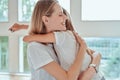 I love my mom. Happy Mothers Day. Beautiful mom with her little cute daughter are having fun at home. Hugging and kissing each Royalty Free Stock Photo