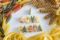 I love pasta text on white plate with colourful pasta letters