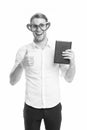 I love reading books. Man cute nerd in heart shaped glasses loves to read books. Guy holds book and shows thumbs up