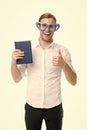 I love reading books. Man cute nerd in heart shaped glasses loves to read books. Guy holds book and shows thumbs up