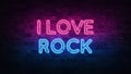 I Love Rock neon sign. purple and blue glow. neon text. Brick wall lit by neon lamps. Night lighting on the wall. 3d Royalty Free Stock Photo