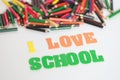 I love school ,School supplies colored pencils in Fall scattered, isolated Royalty Free Stock Photo