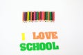 I love school , School supplies colored pencils in a row, isolated Royalty Free Stock Photo