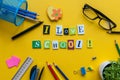 I love School - text made with carved letters on yellow desk with office or school supplies on pupil table Royalty Free Stock Photo