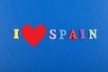 I love SPANISH word on blue background composed from colorful abc alphabet block wooden letters, copy space for ad text