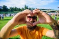 I love summer holiday festival.Hipster happy celebrate event picnic fest festival. Man bearded in front of crowd people