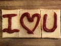 I Love U by bread on the wooden cutting board