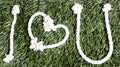 I love u shaped with rope on grass. Royalty Free Stock Photo