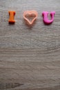 `i love u` word Close-up shot selective focus colorful, magnetic letters with romantic question for Valentine`s Day Royalty Free Stock Photo