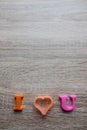 `i love u` word Close-up shot selective focus colorful, magnetic letters with romantic question for Valentine`s Day Royalty Free Stock Photo