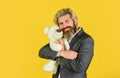 I love it. valentines day gift. man in jacket hold teddy bear. bizarre people concept. businessman play with toy