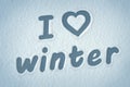 `I love winter` written on the snow