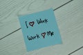 I Love Work and Work Love Me write on sticky notes isolated on Wooden Table