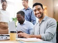 I love working with this team. Cropped portrait of a handsome young businessman sitting with his colleagues in the Royalty Free Stock Photo