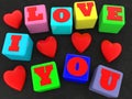 I love you concept on colorful toy blocks on black Royalty Free Stock Photo
