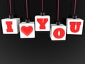 I love you concept on hanging white toy blocks on a black Royalty Free Stock Photo