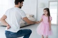 I love you, dad! Handsome young man is dancing at home with his little girl. Happy Father`s Day! Royalty Free Stock Photo