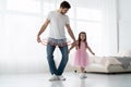 I love you, dad! Handsome young man is dancing at home with his little girl. Happy Father`s Day! Royalty Free Stock Photo