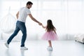 I love you, dad! Handsome young man is dancing at home with his little girl. Happy Father`s Day! Royalty Free Stock Photo