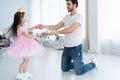 I love you, dad! Handsome young man is dancing at home with his little girl. Happy Father`s Day! Royalty Free Stock Photo