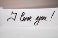 I love you handwriting text on paper. Label tag with lovely message. Romantic love concept for Valentine`s day