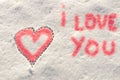 I love you with heart sign writing on the snow. Royalty Free Stock Photo