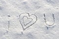 I love you with heart sign writing on the snow. Royalty Free Stock Photo