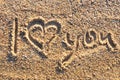 I love you message written in golden sand Royalty Free Stock Photo