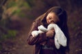 I love you oh so very much. a young girl hugging her teddy bear outside. Royalty Free Stock Photo