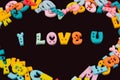 I love you phrase written by plastic colorful letters on blackboard.