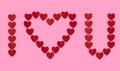 I love you in red heart shaped paper confetti with blank pink background Royalty Free Stock Photo