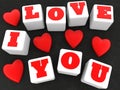 I love you and red hearts concept on white cubes Royalty Free Stock Photo