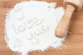 I love you white flour on wooden table Royalty Free Stock Photo