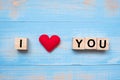 I LOVE YOU wooden cubes with red heart shape decoration on blue table background and copy space for text. Love, Romantic and Happy Royalty Free Stock Photo